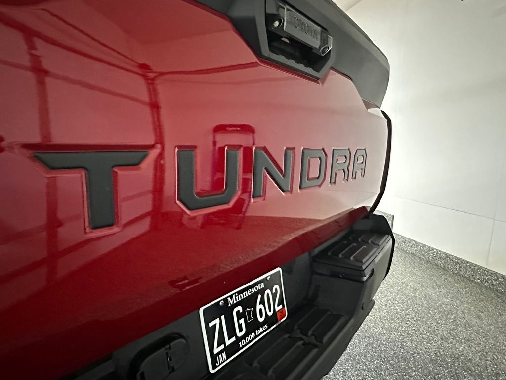 Red Toyota Tundra truck rear with black 