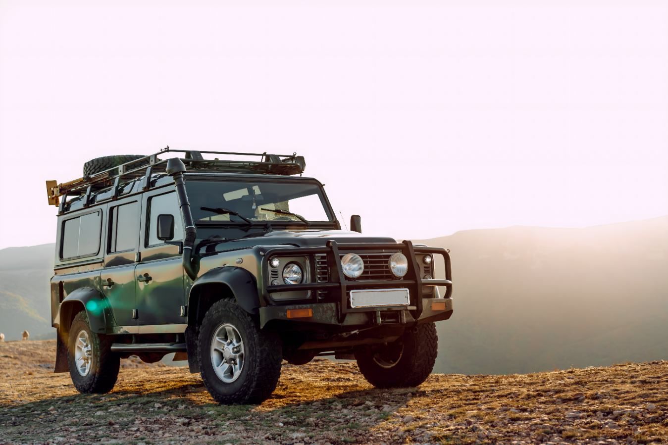 A Black Jeep Is Parked On Top Of A Dirt Hill — Borg's Brake & Front End Service In Mackay, QLD