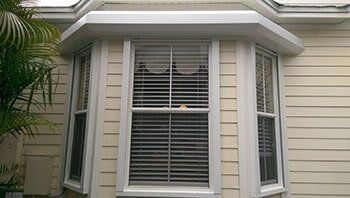 Storm shutter in a house — hurricane shutters Ormond Beach FL in Ormond Beach, FL