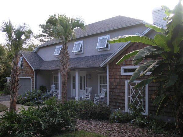Storm shutter in a brown house — hurricane shutters Ormond Beach FL in Ormond Beach, FL