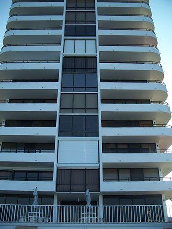 Beige Commercial Building — hurricane shutters Ormond Beach FL in Ormond Beach, FL