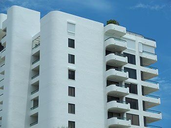 White building — hurricane shutters Ormond Beach FL in Ormond Beach, FL