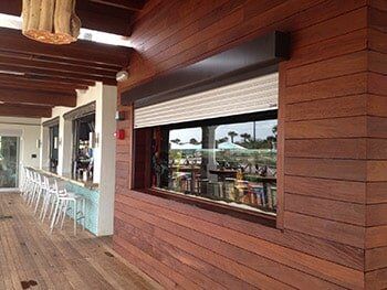 Roll up shutter in a window — hurricane shutters Ormond Beach FL in Ormond Beach, FL
