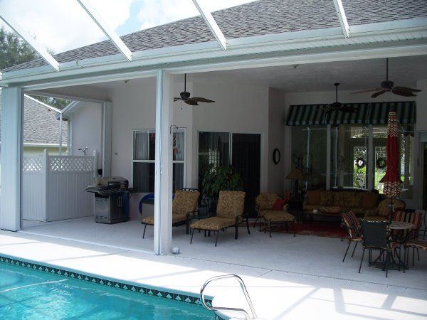 Accordion pool enclosure open — hurricane shutters Ormond Beach FL in Ormond Beach, FL