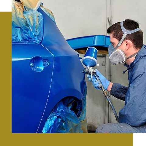 Man Painting a Blue Car — South San Francisco, CA — Royalty Auto Collision Center
