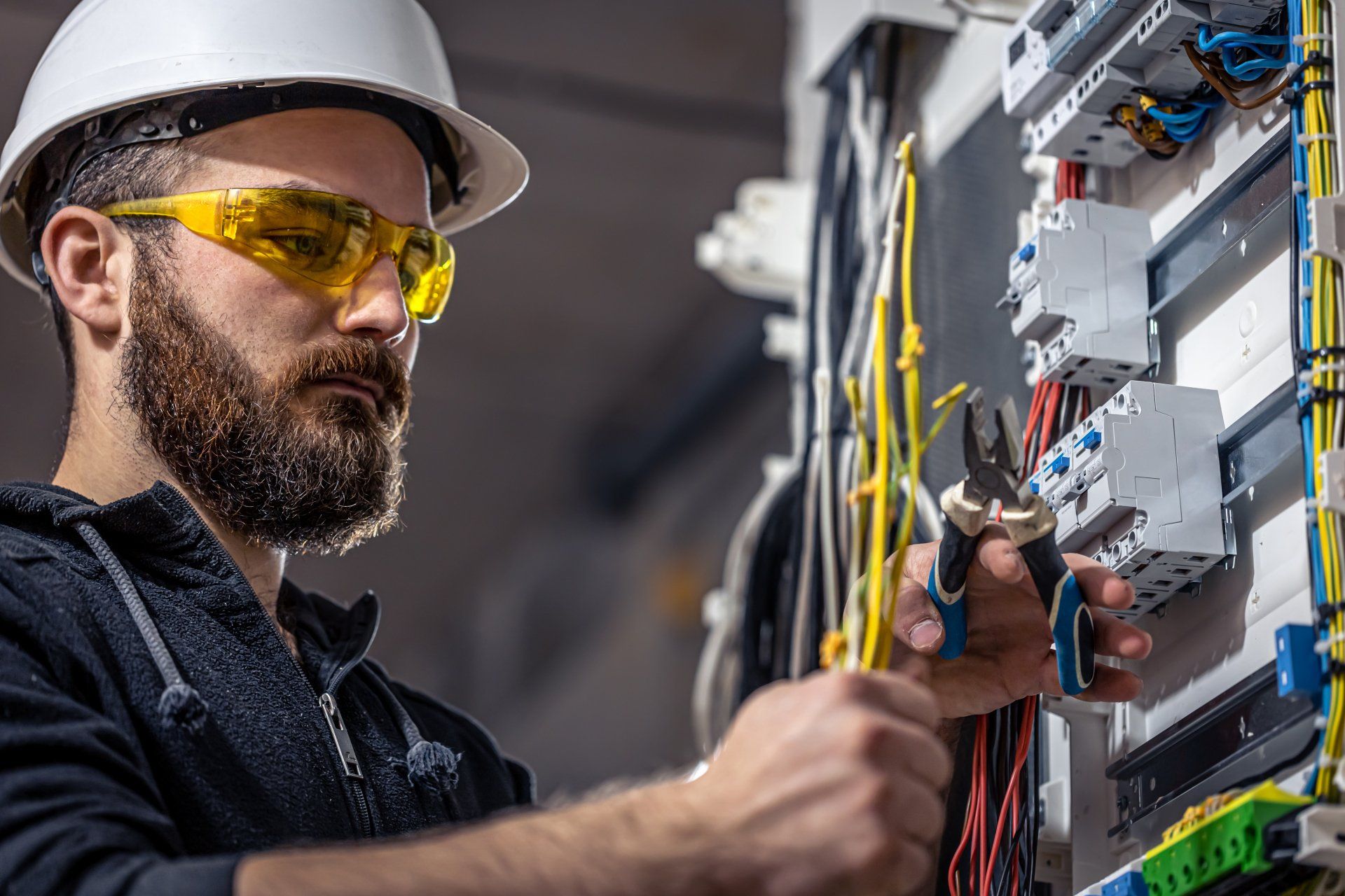 Electrician Connecting Electrical Cable — Ipswich QLD — Enever Electrical Pty Ltd