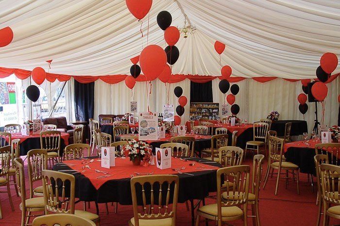 red and black balloon centrepieces and decorations with dining area