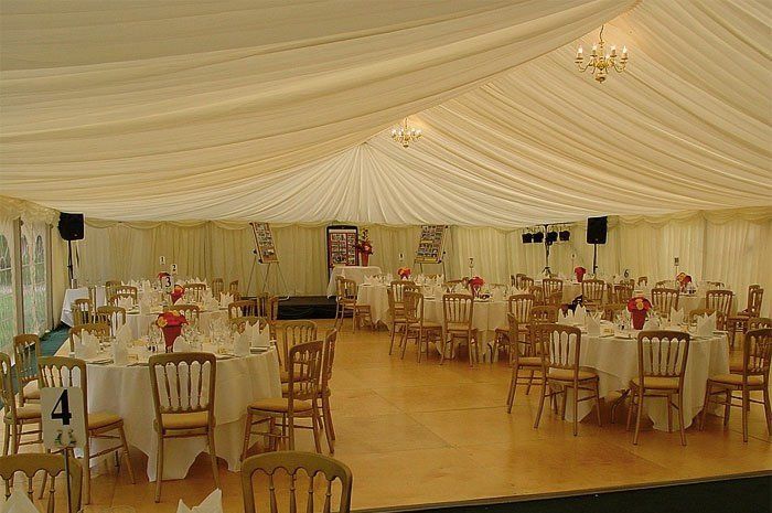beautiful chandelier installed at the dining area on a marquee