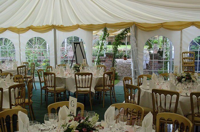 dining area well decorated with flowers and linen cloth