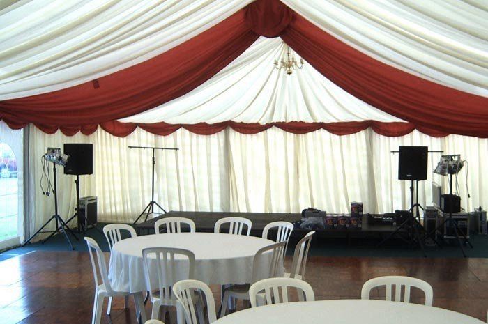 interior decoration of a marquee arranged with chairs and tables