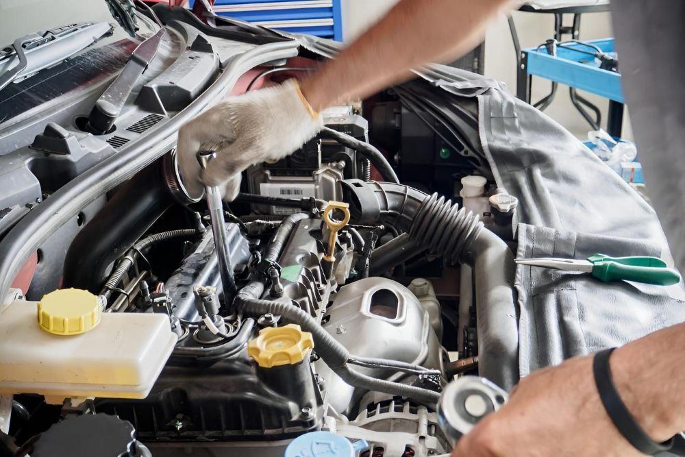 A Man is Working on the Engine of a Car — Stanger Automatics in Ballina, NSW