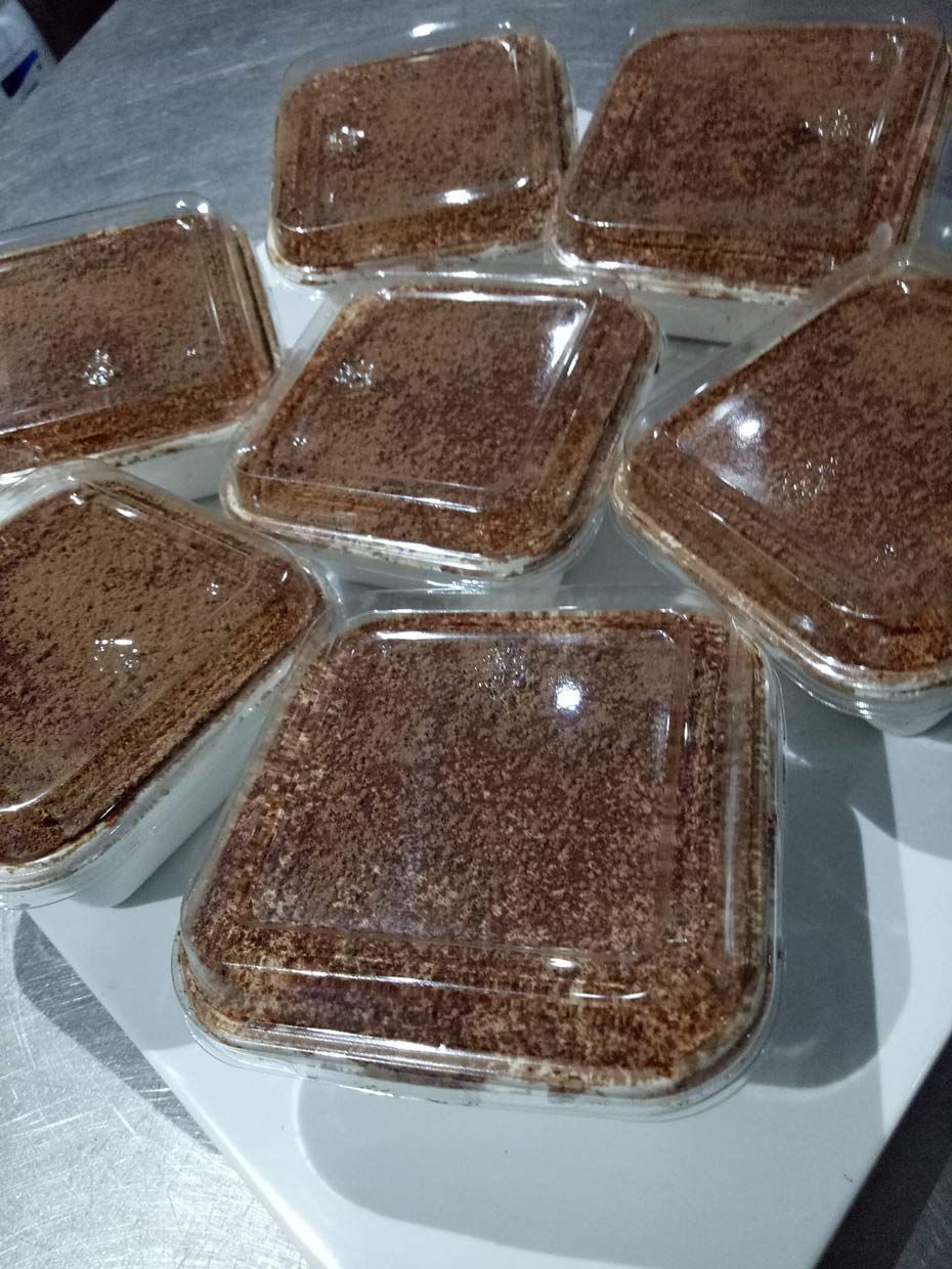 A Bunch Of Chocolate Desserts In Plastic Containers On A Table — Bel-Air Pizza In Port Macquarie, NSW