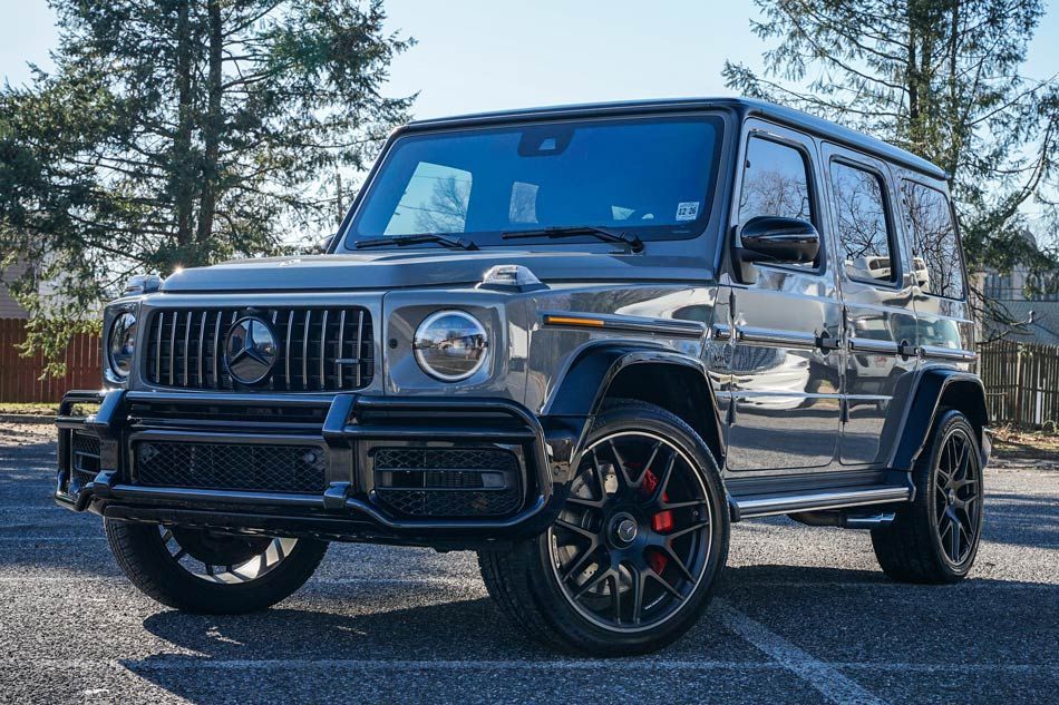 A mercedes benz g63 amg is parked in a parking lot.