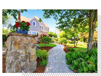 A house with a stone walkway leading to it