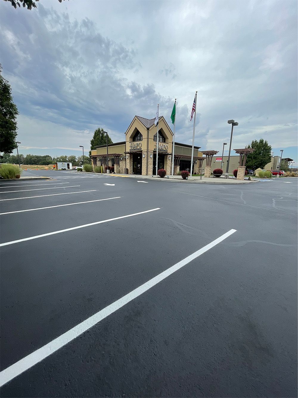 A parking lot with a building in the background