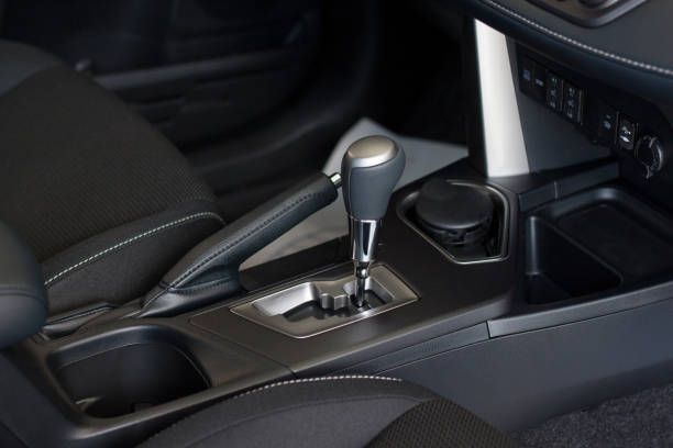 A close up of a car shifter with the number 7 on it