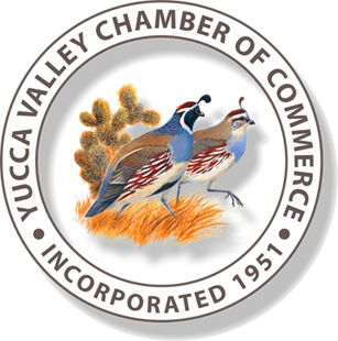 Yucca Valley Chamber of Commerce seal with quail, desert plants, and text "Incorporated 1951."