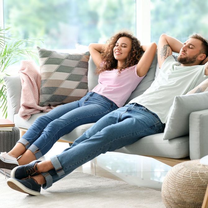 Couple relaxing on sofa