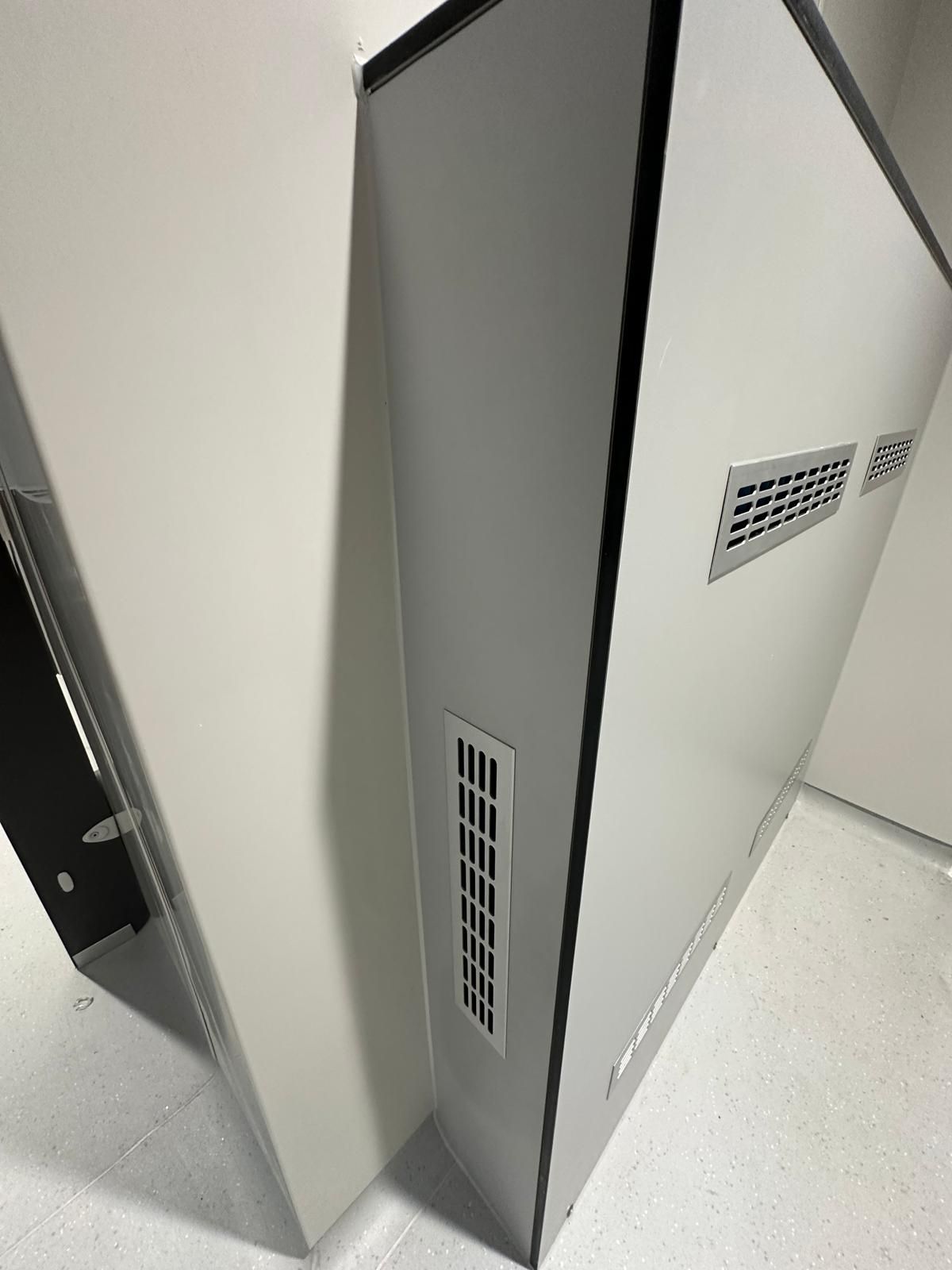 A close up of a white box with a vent on the side.
