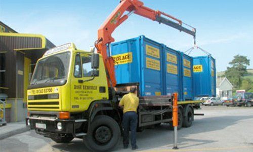 unloading containers from an open haulage truck