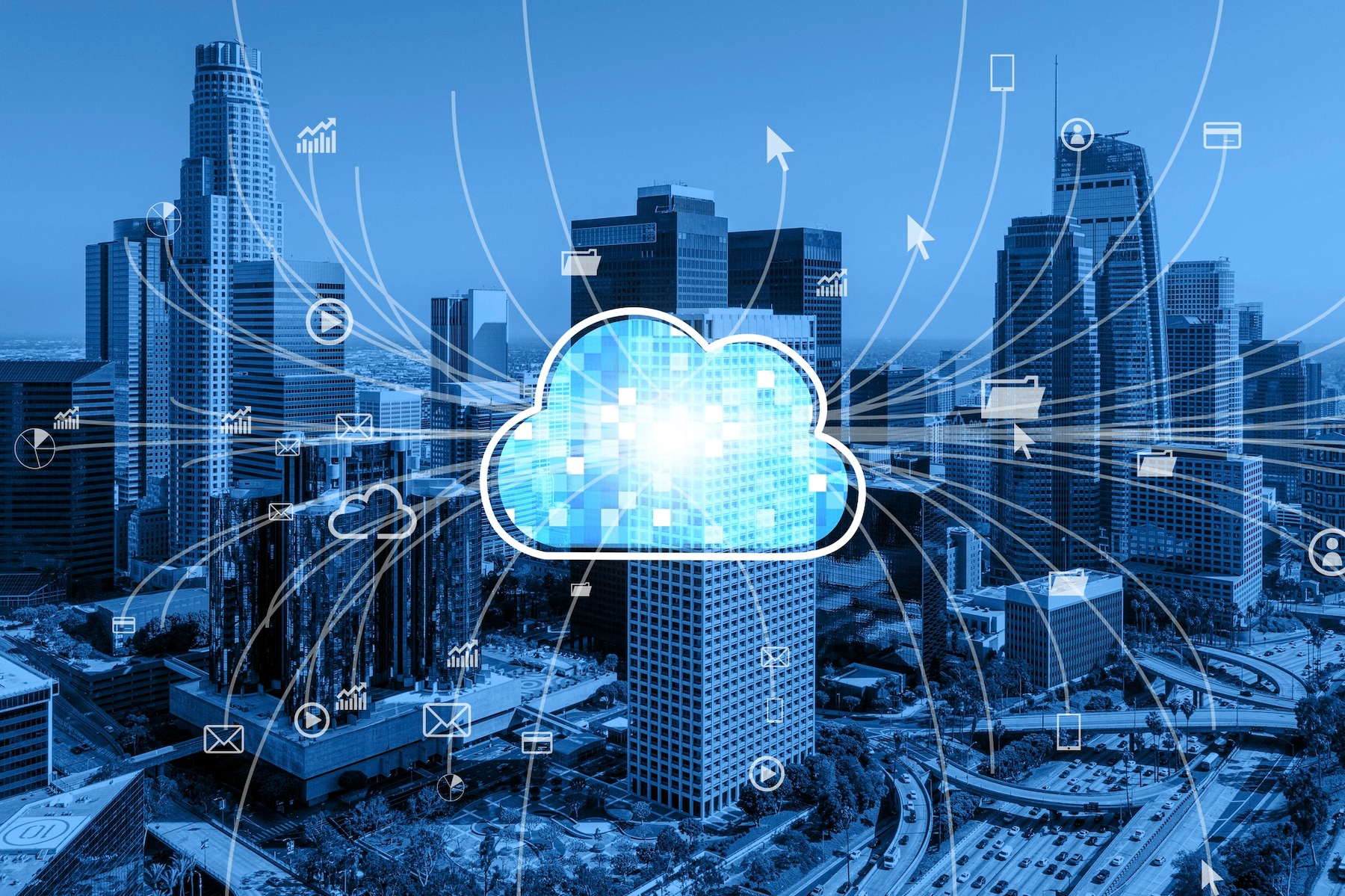 Cloud symbol over a cityscape with data connections, in shades of blue.