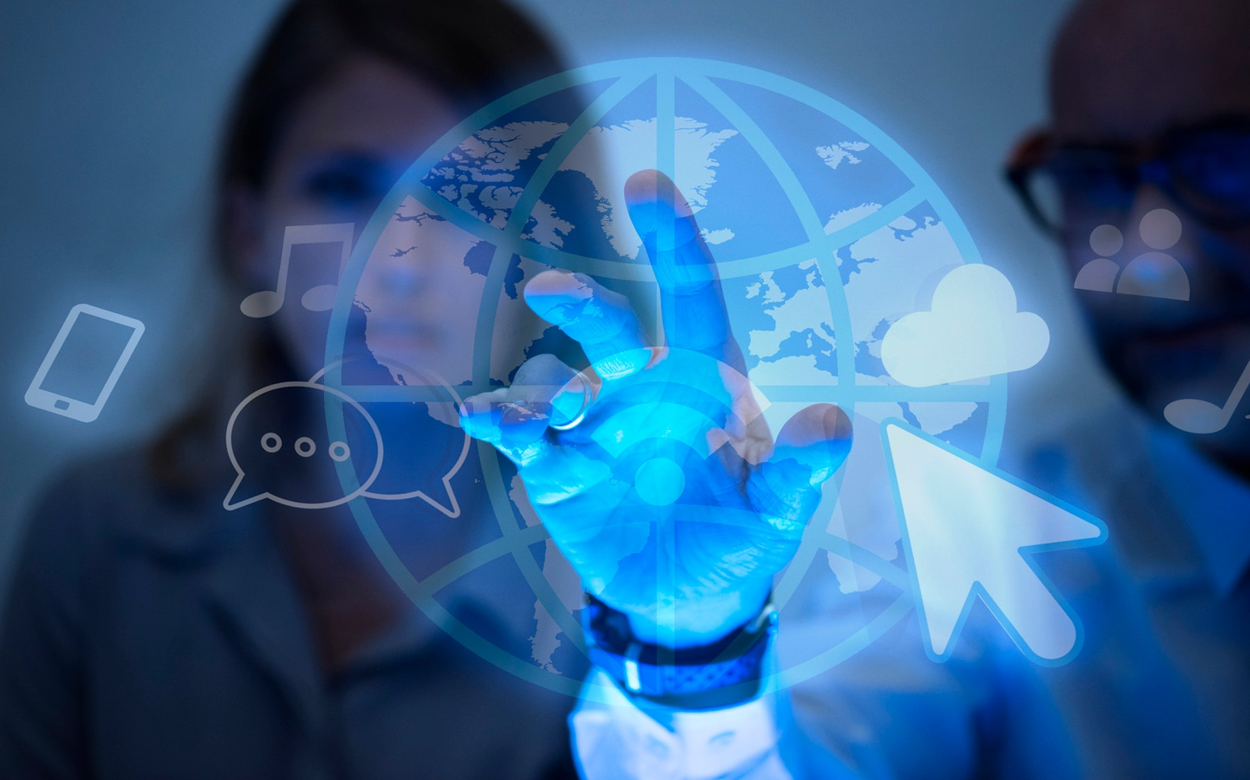 Person's hand touching a glowing globe with digital icons, indicating global technology and communication.