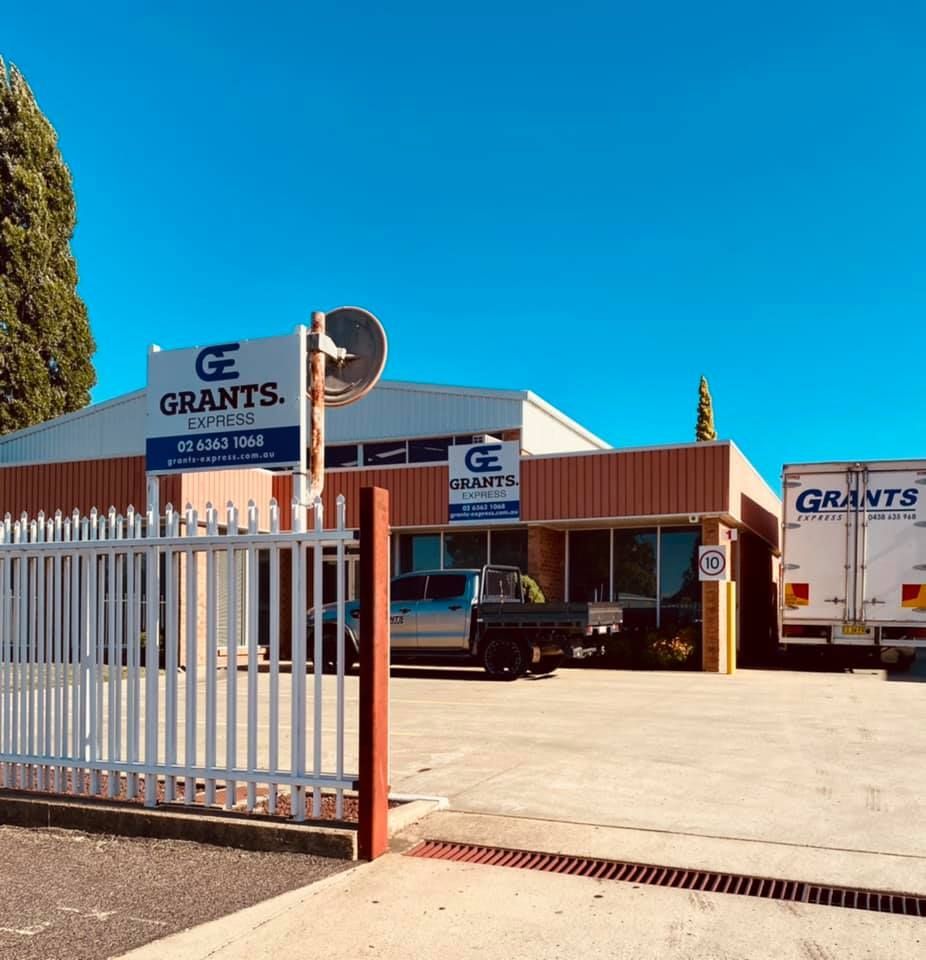 White Truck That Says Grants is Parked in Front of a Building — Grants Express in Parkes, NSW