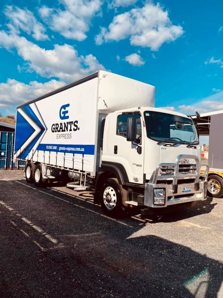 White and Blue Truck is Parked in a Parking Lot — Grants Express in Orange, NSW