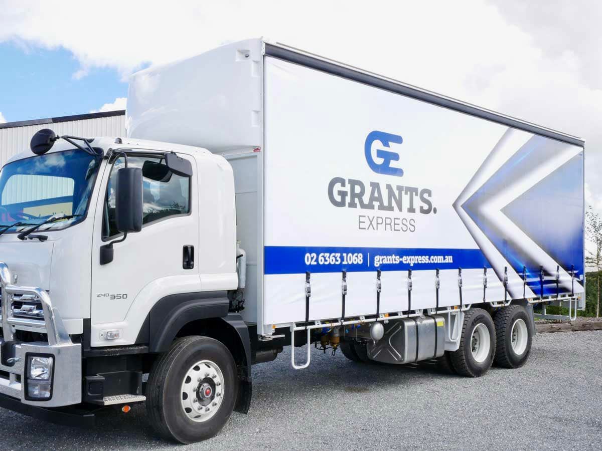 Grants Express Truck is Parked in a Gravel Lot — Grants Express in Smeaton Grange, NSW