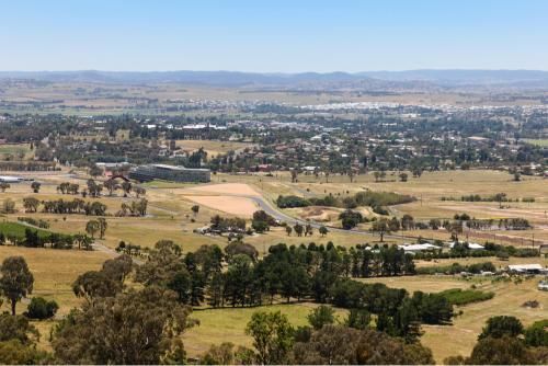An Aerial View of a City Surrounded by Fields and Trees — Grants Express in Bathurst, NSW