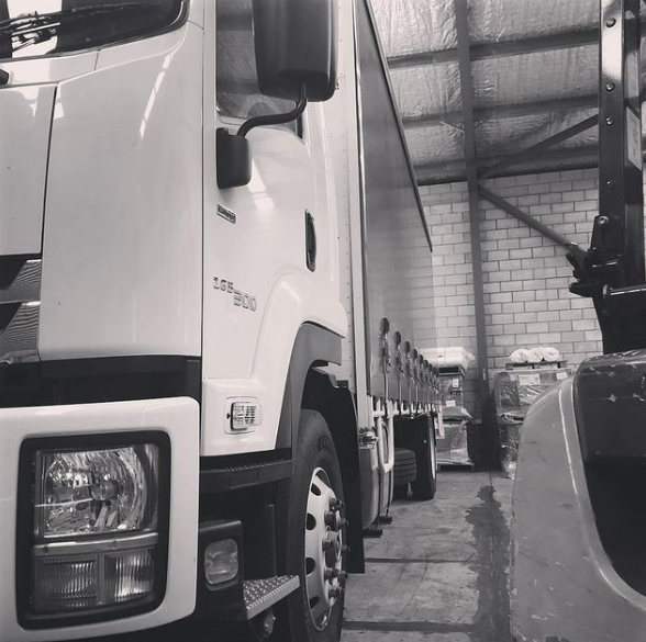 Black and White Photo of a Row of Trucks — Grants Express in Parkes, NSW