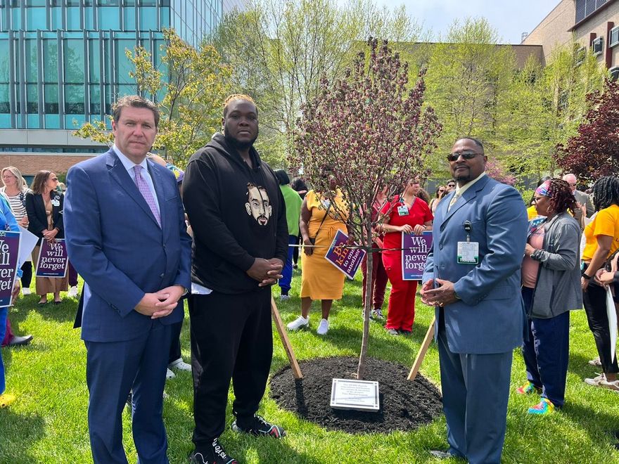 Image of Mark Talley planting a commemorative tree