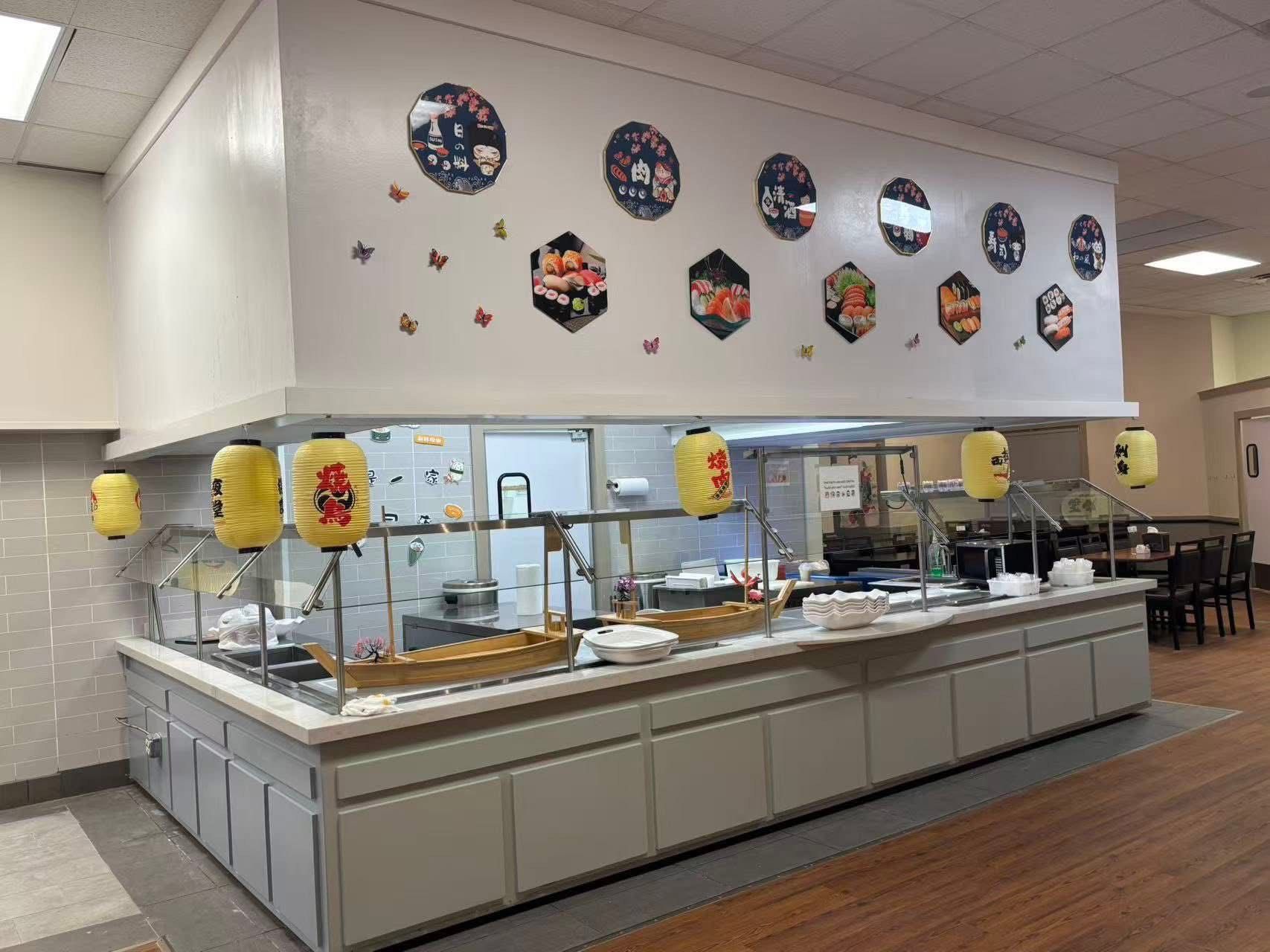 Buffet with trays of rice and vegetables; blurry background with fruit. Buffet with trays of rice and vegetables; blurry background with fruit.