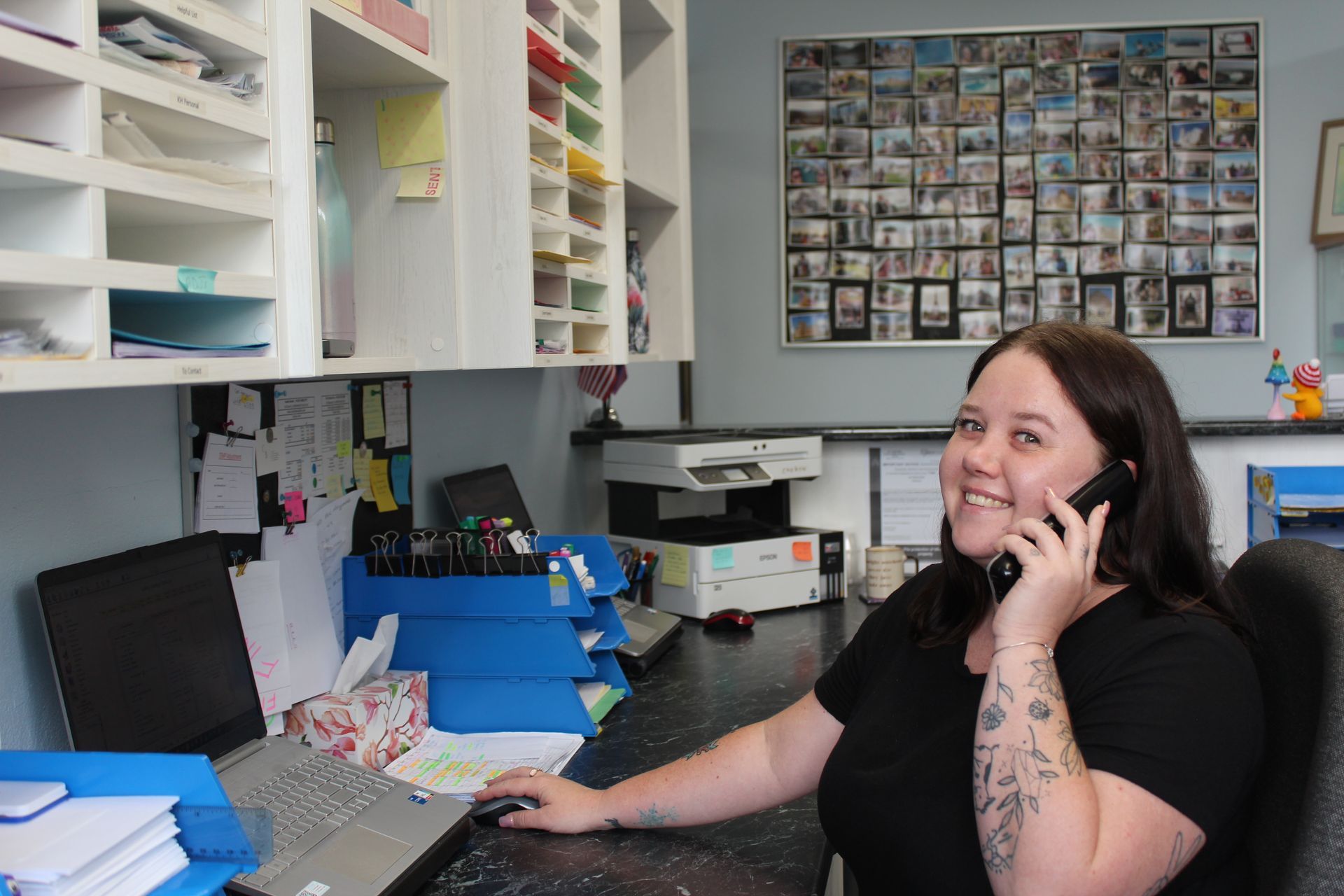 Female receptionist answering the phone — Dentures in Toukley, NSW