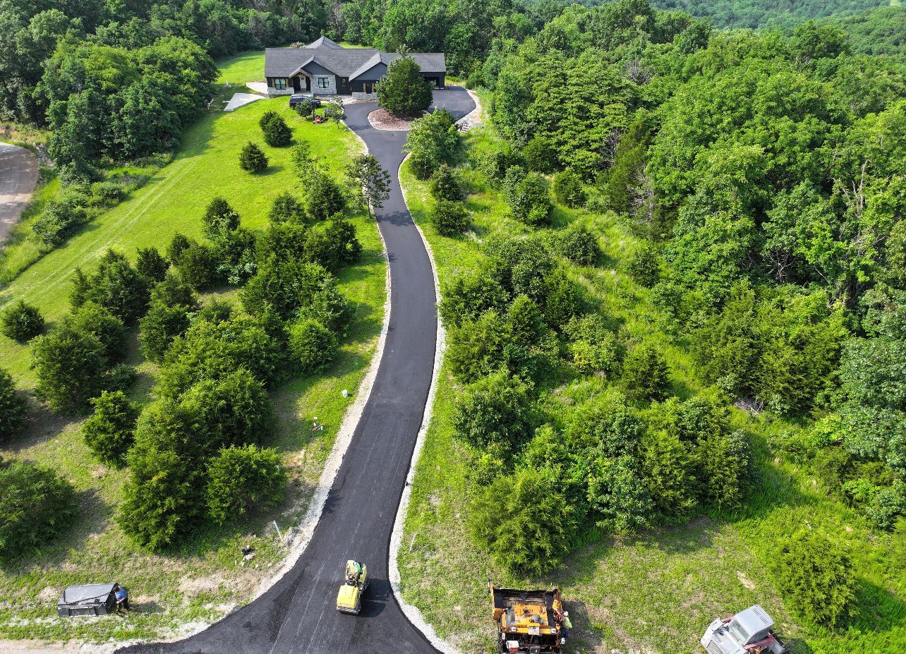 A close up of a road with trees on the side of it.