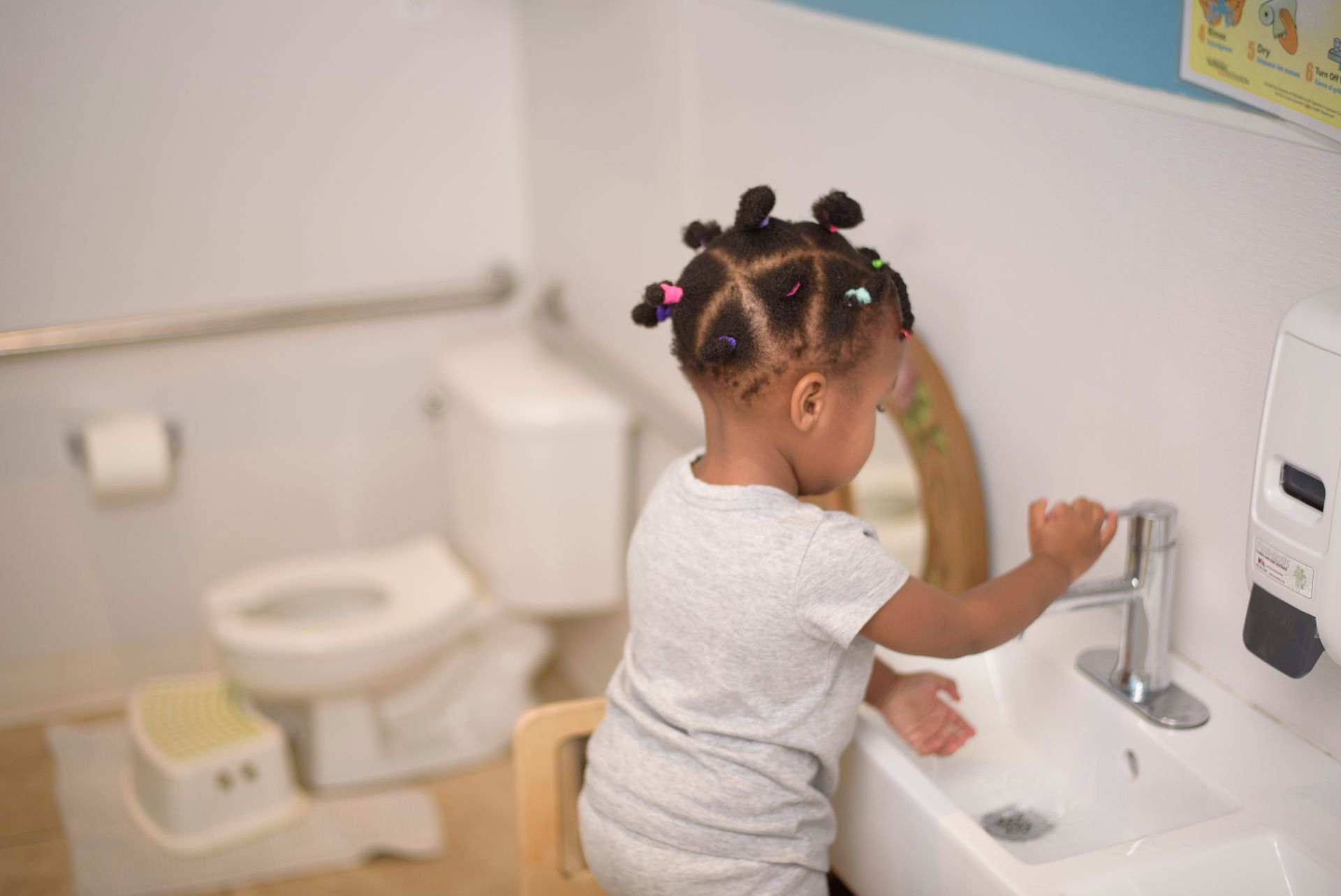Montessori child learning toilet skills