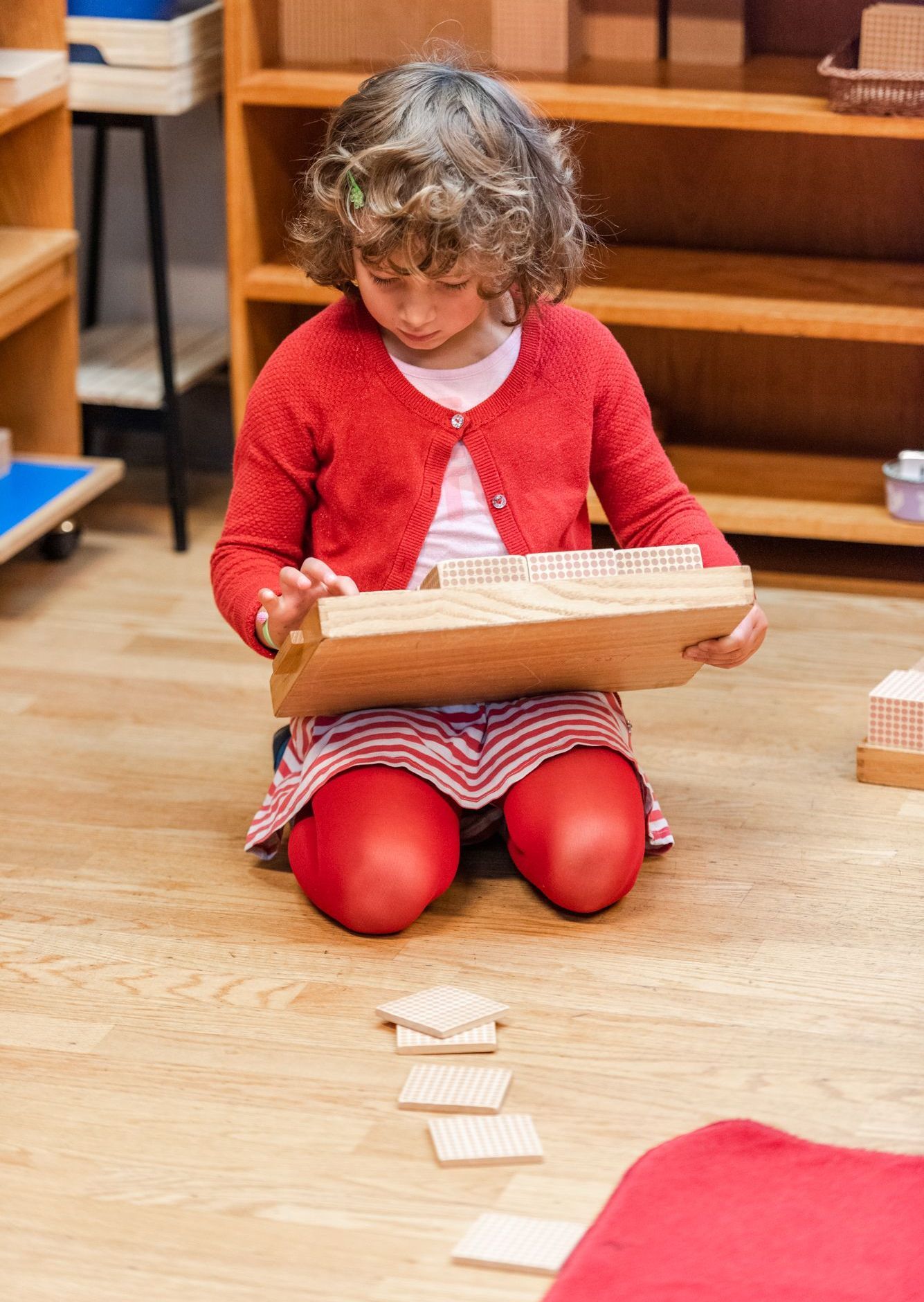 montessori child working with math activity