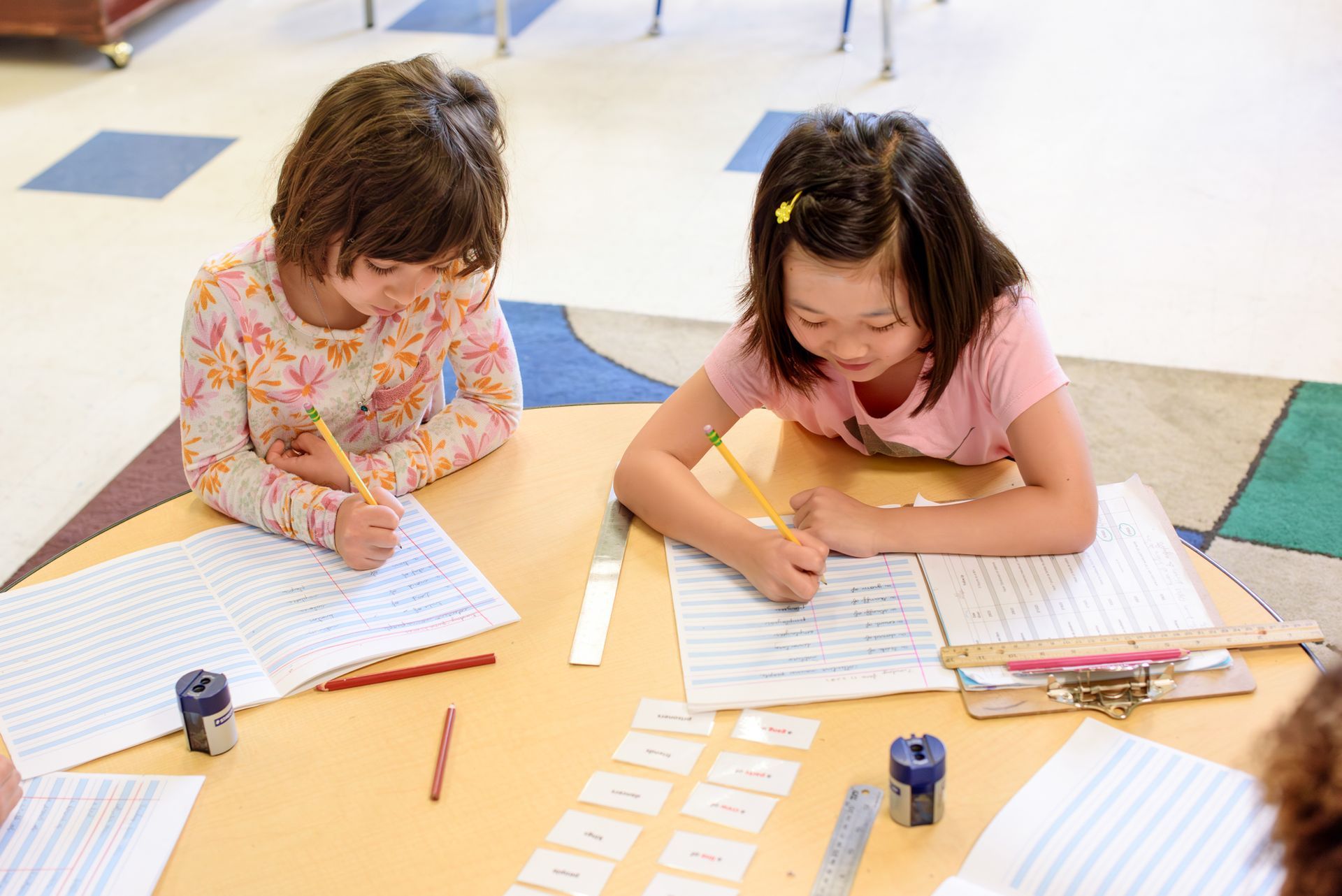 Montessori children working on language arts skills