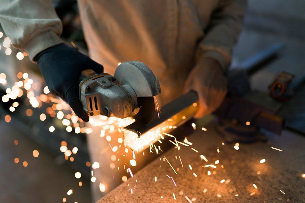 Cutting Iron Bar With Cutter — Nashville, TN — Insulation Supply Company