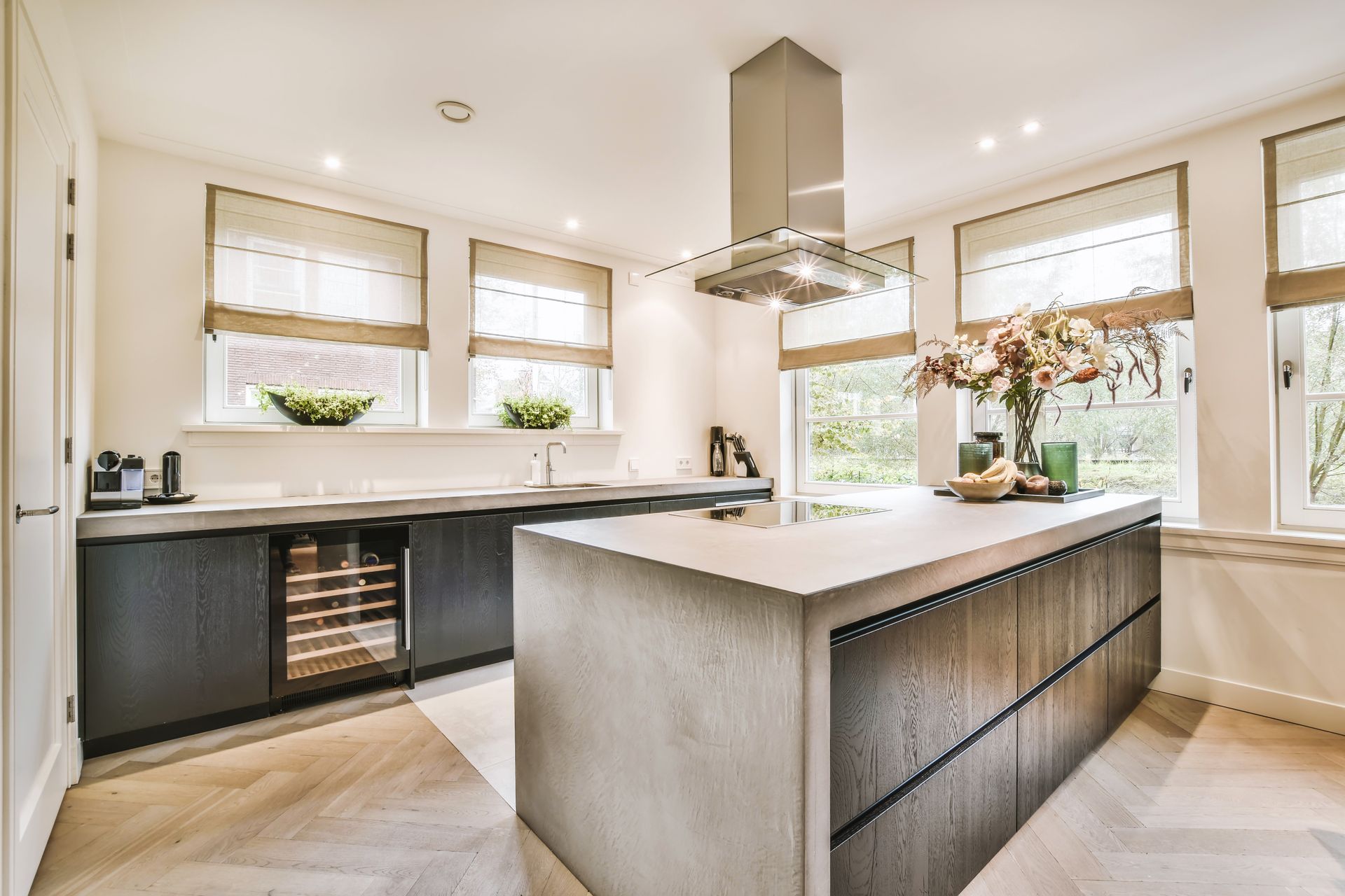 A kitchen with a large island in the middle of the room.