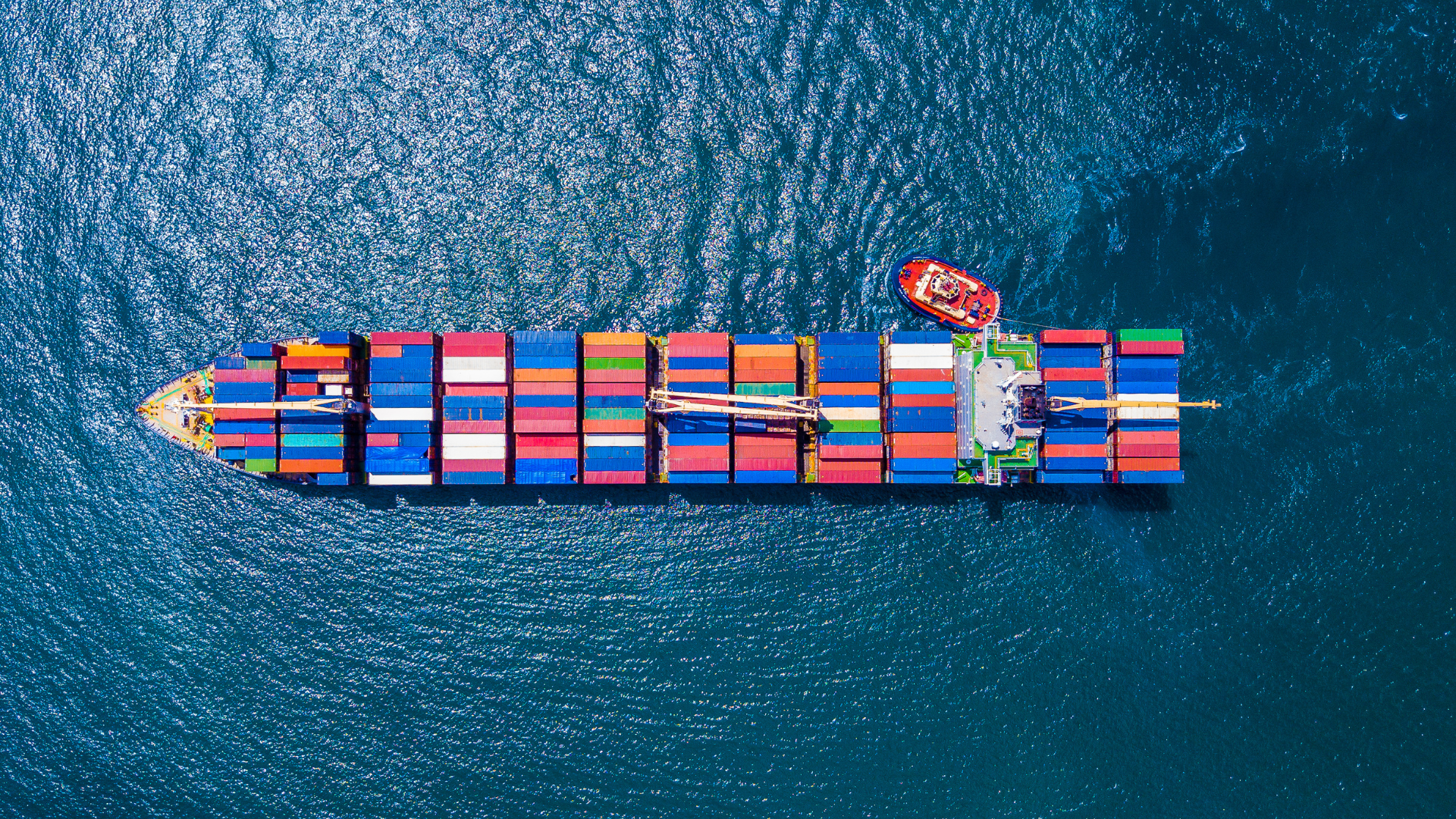an aerial view of a large container ship in the ocean .