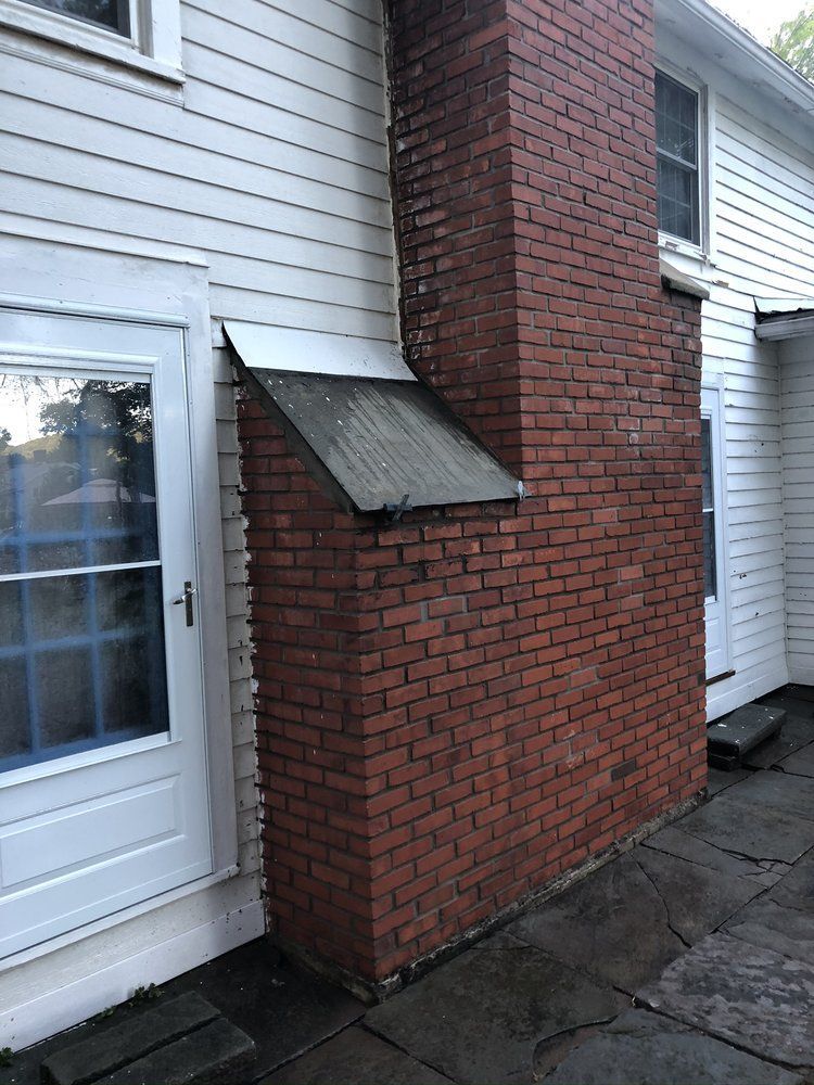 Chimney Bricks On Backyard — Binghamton, NY — United Masonry Contractors
