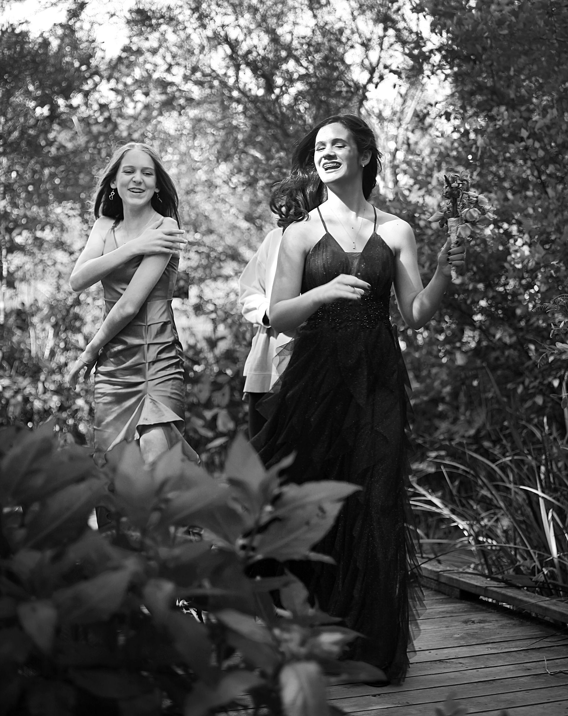Two women are standing next to each other in a black and white photo.