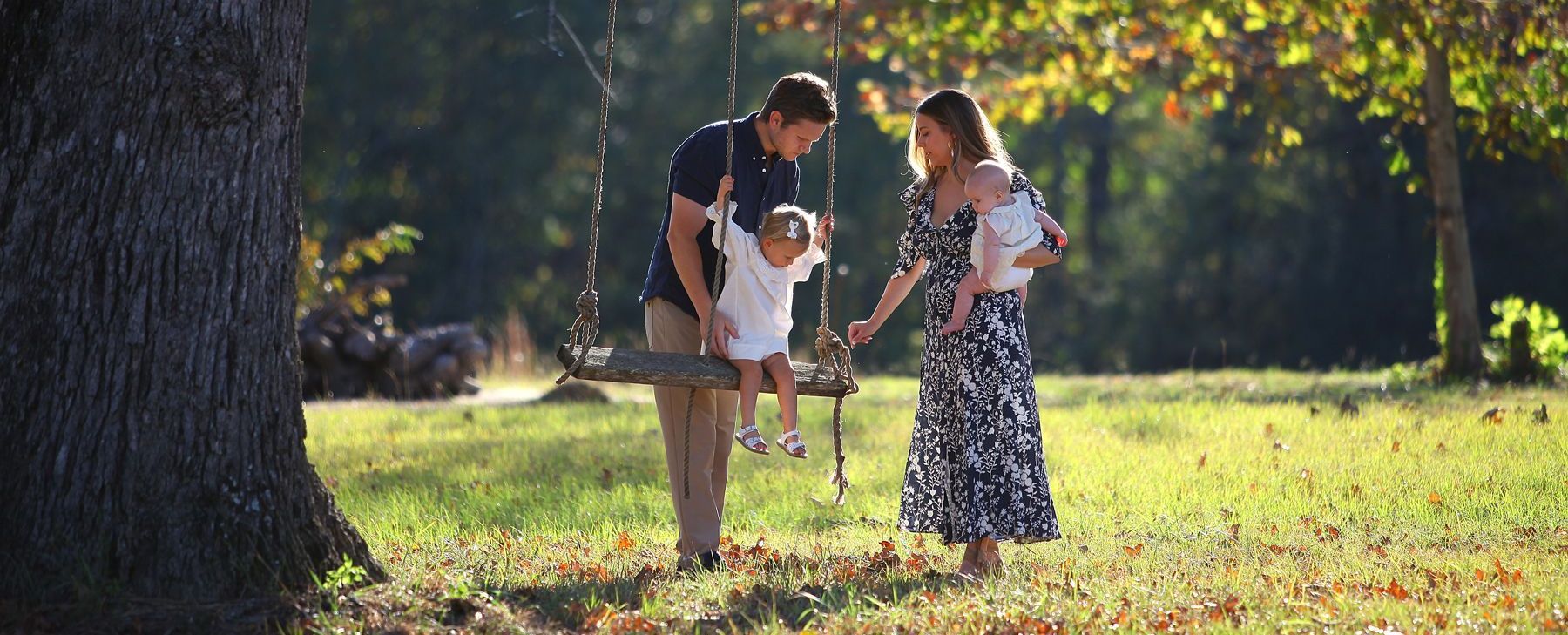 A group of people are holding sparklers at a wedding reception.