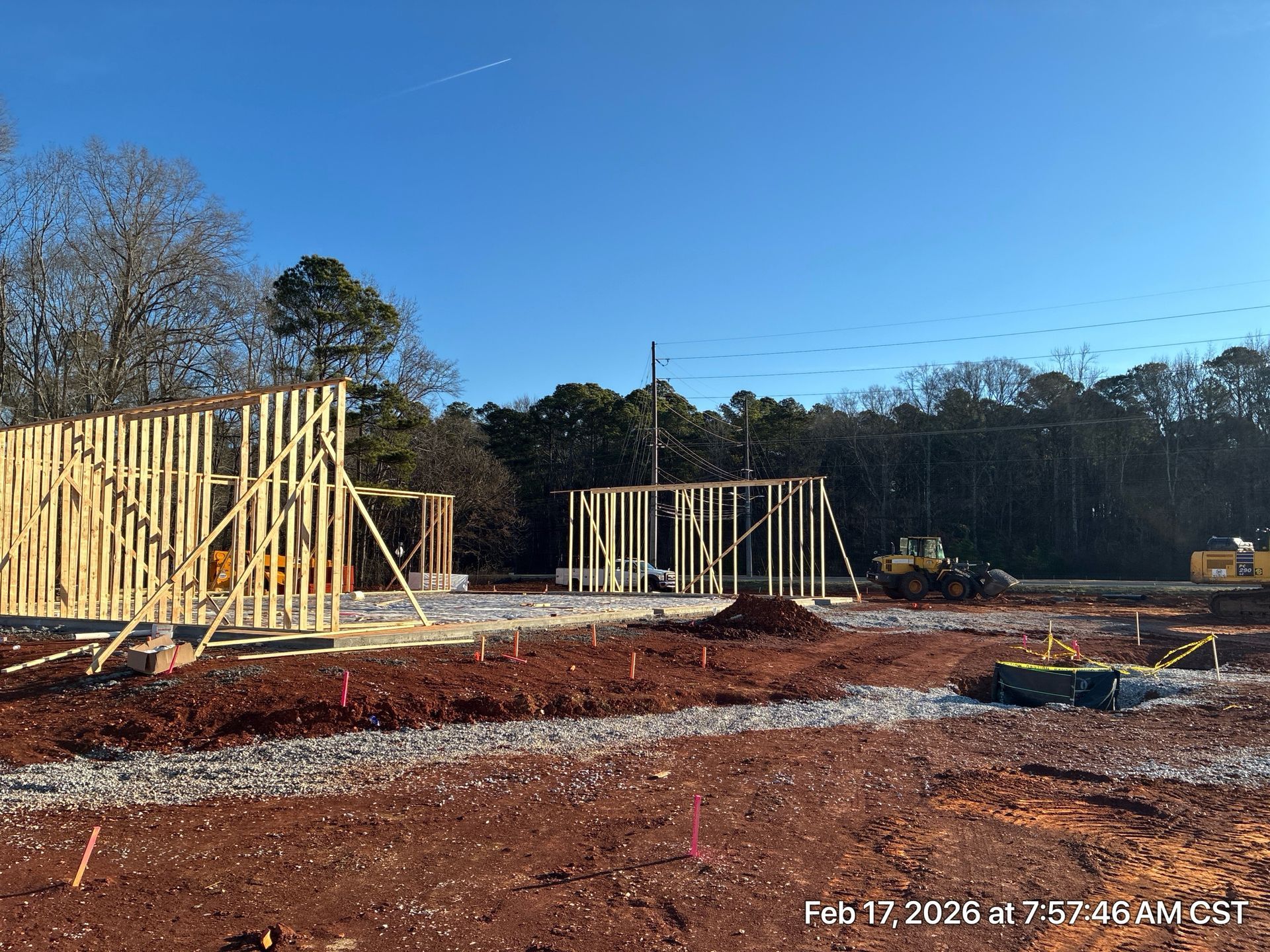 Dental office building exterior with brick and light grey facade, black awnings and signage.