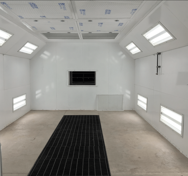 a room with white walls and a black mat on the floor