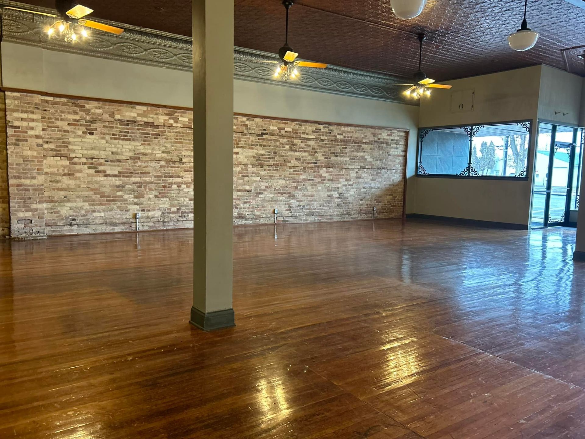 A table set for a baby shower with plates , glasses , and a cake.