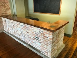 A group of people are holding sparklers and champagne glasses.