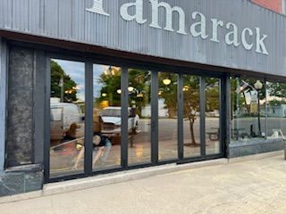 A stack of graduation caps with tassels on a table