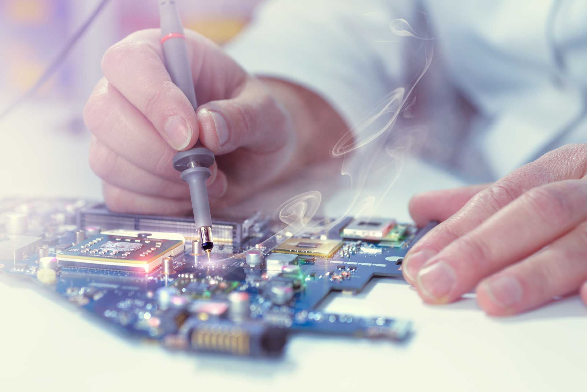 Person in lab coat uses probe on circuit board; sparks and glow indicate testing.